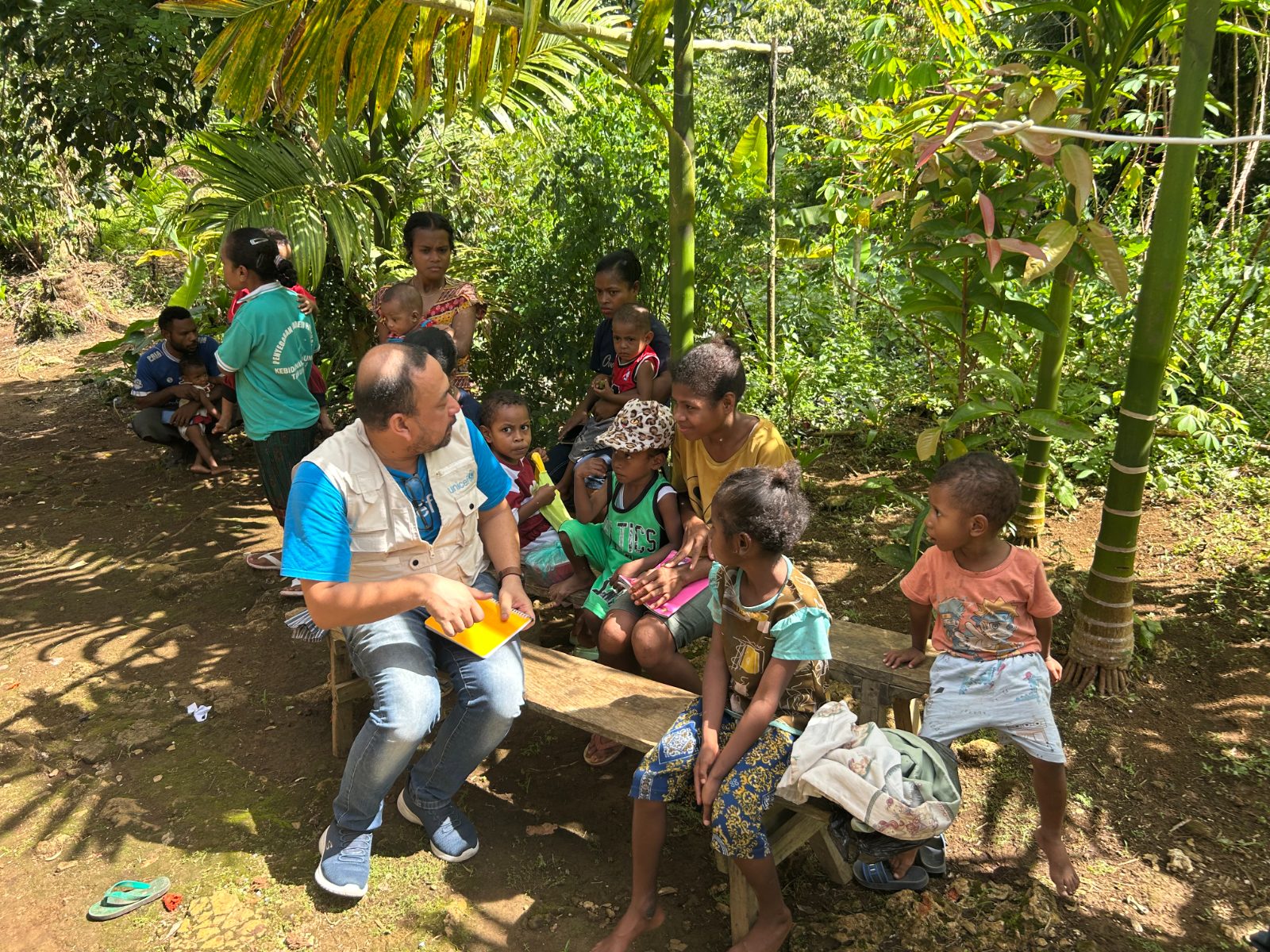 Research team walking through the village